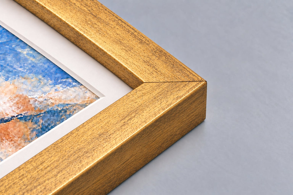 Corner of the antique gold lustre frame with a mounted print